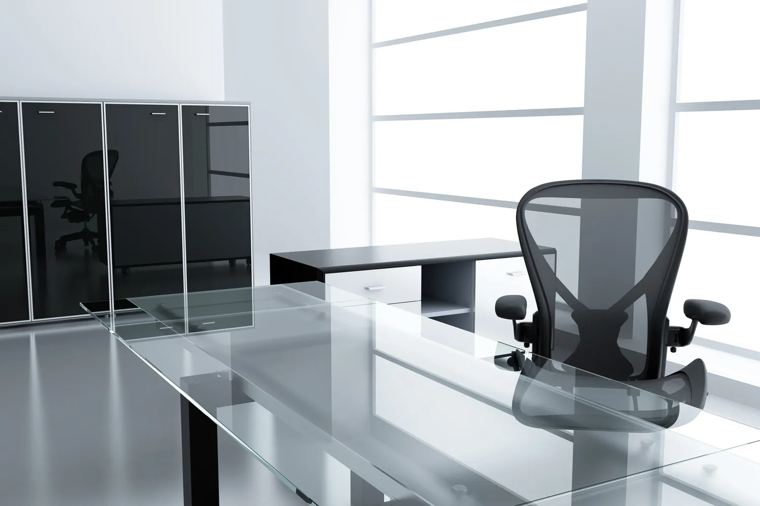 Clear glass desk surface in a modern office, an example of glass table tops Chicago offices use
